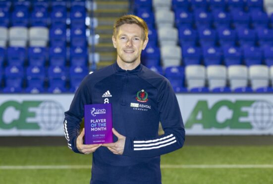 Cove Rangers midfielder Blair Yule with the League One player of the month award for December