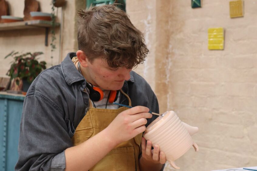 AJ works on a Japanese tea-set for Raku week in The Great Pottery Throw Down.