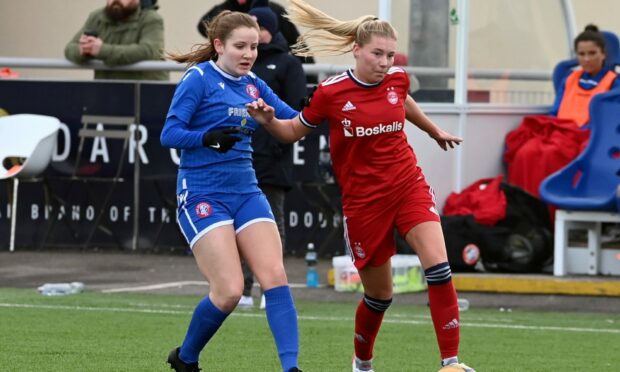 Aberdeen Women's Francesca Ogilvie battles for the ball with Spartans Rosie McQuillan. Picture by Kenny Elrick.