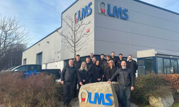 LMS sales director Millar Kennedy, front left, and managing director Kirk Anderson, front right, with the rest of the LMS team at their new HQ.