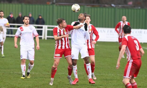Formartine United's Kieran Lawrence and Brechin City's Julian Wade contest a header