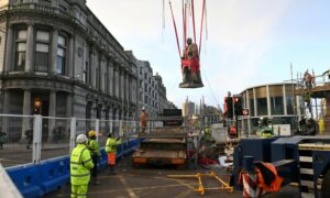 Workers return the statue of Edward VII as part of the refurbishment of Union Terrace Gardens. Picture by Paul Glendell.