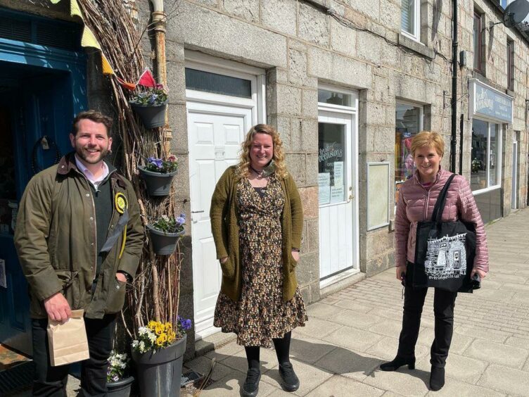Jodie with the First Minister and another SNP member outside her shop
