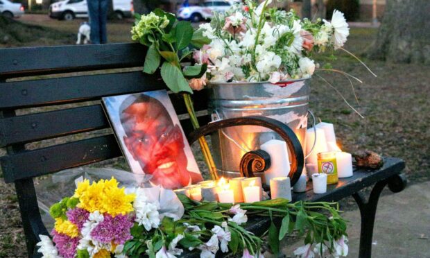 A candelit vigil, marking the one-year anniversary of the death of Ahmaud Arbery (Photo: Bryan Dozier/Shutterstock)