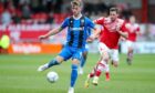 Gillingham defender Jack Tucker (6) passes the ball during a League 1 match against Crewe Alexandra.