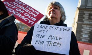 Protesters demonstrate against prime minister Boris Johnson and the 'partygate' scandal outside parliament in London