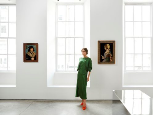 Victoria Beckham with some of the Old Masters paintings (Sotheby’s/PA)