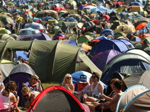 Festival-goers in a camp site at Bestival, held at Robin Hill Country Park on the Isle of Wight (Yui Mok/PA)