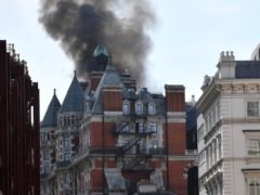 Smoke rises from the Mandarin Oriental Hotel in Knightsbridge, central London, after 97 firefighters were called to a fire (John Stillwell/PA)
