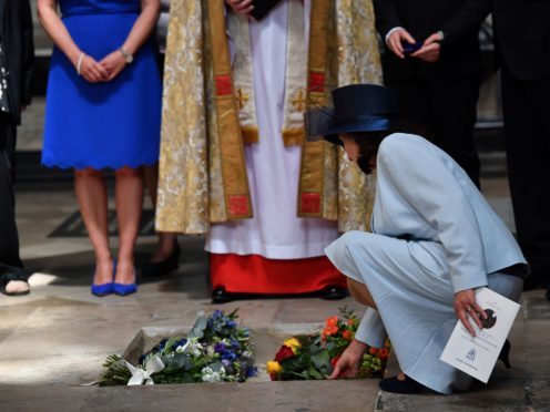 Jane Hawking lays flowers as the ashes of Professor Stephen Hawking are laid to rest during his memorial service at Westminster Abbey (Ben Stansall/PA)