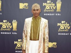 Keiynan Lonsdale accepted the prize for Best Kiss at the MTV Movie And TV Awards. (Jordan Strauss/Invision/AP)