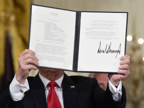 President Donald Trump shows off a ‘Space Policy Directive’ (Susan Walsh/AP)