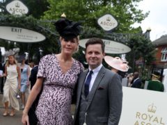 Declan Donnelly and Ali Astall pose for photographers on day two of Royal Ascot at Ascot Racecourse.