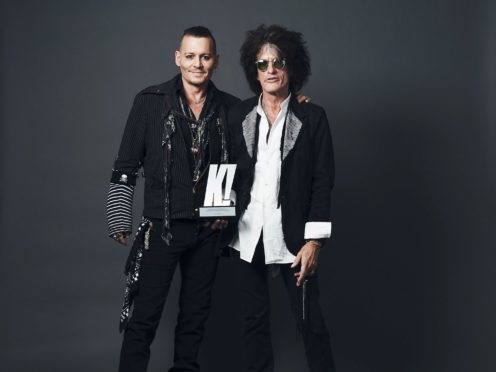 Undated handout photo issued by Kerrang! Magazine of Johnny Depp, as he presents Joe Perry with a Kerrang! Icon Award at Islington Assembly Hall, London (Kerrang! Magazine)