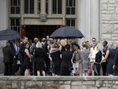 Mourners gather outside the church in Kansas City (Orlin Wagner/AP)
