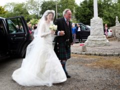Rose Leslie with her father Sebastian Leslie arrive at Rayne Church, Kirkton of Rayne in Aberdeenshire, for her wedding (Jane Barlow/PA)