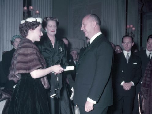 Princess Margaret and Christian Dior (Photo by Popperfoto/Getty Images)