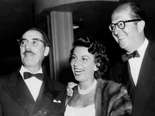 Nancy Sinatra, wife of actor and singer Frank Sinatra, with comedians Groucho Marx and Phil Silvers at a Hollywood party (PA)