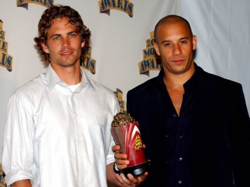 Paul Walker and Vin Diesel pose with their award for best on-screen team back stage at the 2002 MTV Movie Awards at Shrine Auditorium, Los Angeles (Anthony Harvey/PA)
