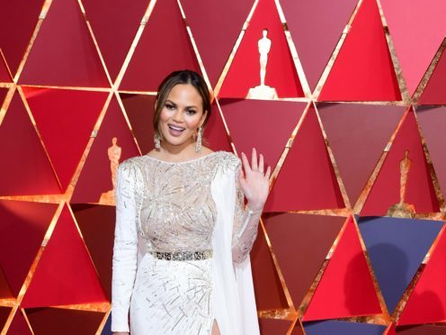 Chrissy Teigen ‘queen of the bugs’ after playing with large tarantula hawk wasp (Ian West/PA)