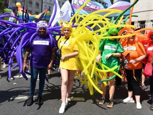 People take part in the Pride in London Parade in central London (PA)