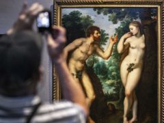 Visitors look at the painting Adam And Eve by Flemish master Peter Paul Rubens at the Rubenshouse in Antwerp (Olivier Matthys/AP)