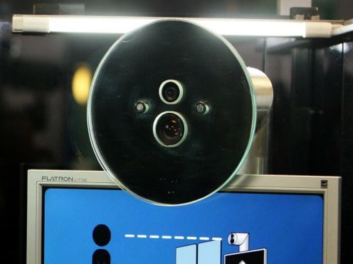A facial recognition system at an airport (Dave Thompson/PA)