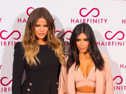 Khloe Kardashian and Kim Kardashian West (PA)