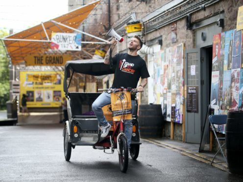 Comedian Joel Dommett sets off from the Pleasance Grand, Edinburgh, on a rickshaw to visit 100 shows at the Edinburgh Fringe Festival (Jane Barlow/PA)