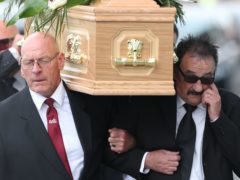 Paul Elliott carries the coffin of his brother Barry Chuckle (real name Barry Elliott) at the New York Stadium, Rotherham (Danny Lawson/PA)