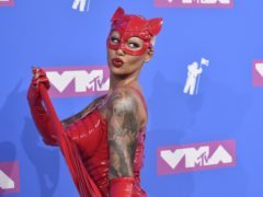 Amber Rose stood out on the red carpet of the MTV Video Music Awards in a daring red costume (Evan Agostini/Invision/AP)