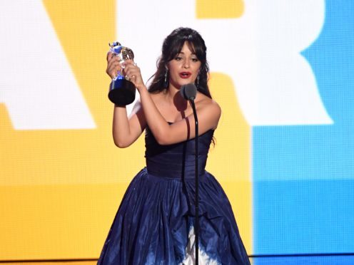 Camila Cabello accepts the award for artist of the year (PA)
