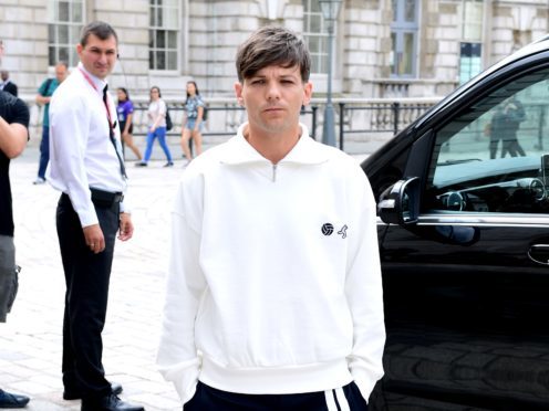 Louis Tomlinson fought back tears as a singer he helped returned to X Factor (Ian West/PA)