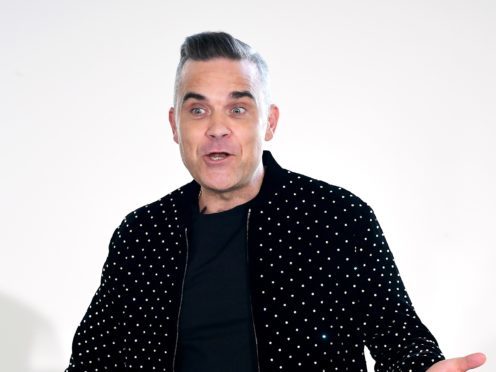 Robbie Williams was praised by X Factor host Dermot O’Leary (Ian West/PA)