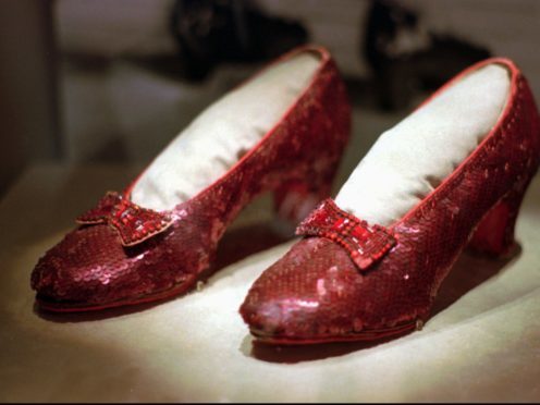 One of the four pairs of ruby slippers (AP Photo/Ed Zurga, File)