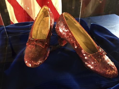A pair of ruby slippers once worn by actress Judy Garland in The Wizard Of Oz are displayed at a news conference at the FBI office in Brooklyn Centre, Minneapolis (Jeff Baenen/AP)