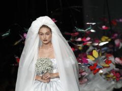 Gigi Hadid wears mini puffball wedding dress at star-studded Moschino show (Antonio Calanni/AP/PA)