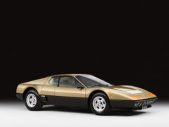 The car, with its chestnut brown interior, is one of only four Ferrari 512 BBs painted in its shade of metallic gold (Sotheby’s/PA)