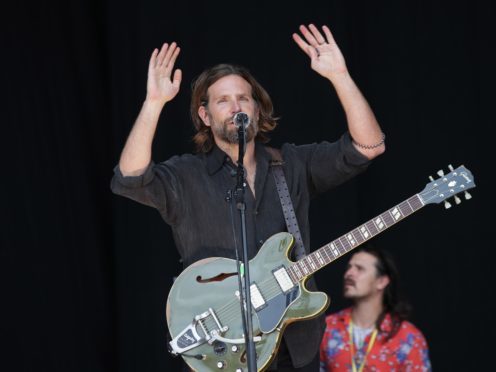 Bradley Cooper filming scenes from A Star is Born on the Pyramid Stage, before Kris Kristofferson takes to the stage, at the Glastonbury Festival (PA)