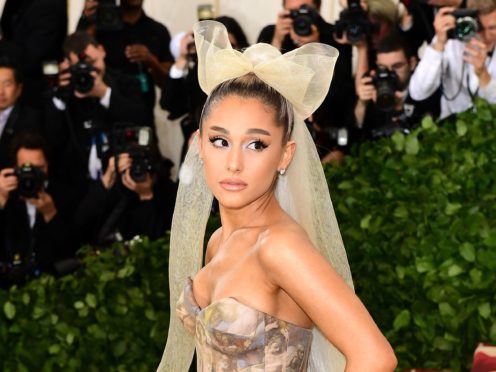 Ariana Grande appears topless in the image but covered in body paint (PA)