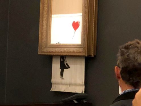 The buyer of a Banksy artwork partially shredded moments after the auction finished will go through with the sale (Sotheby’s/PA)