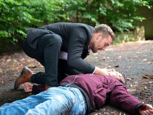 Ali Neeson, played by James Burrows, comes to the aid of Ryan Connor, played by Ryan Prescott, after he is hit by drug dealer Ronan Truman’s car (Mark Bruce/PA)