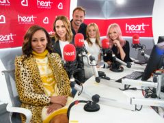 Spice Girls Melanie Brown, Melanie Chisholm, Geri Horner and Emma Bunton on the Heart Breakfast Show with host Jamie Theakston (Matt Crossick/PA)