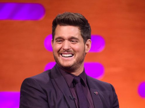 Michael Buble triumphed over Mumford & Sons to claim his fourth number one album (Matt Crossick/PA)