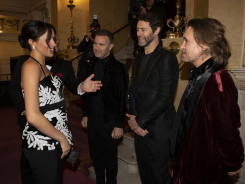 The Duchess of Sussex meeting Gary Barlow, Howard Donald and Mark Owen of Take That (Ian Vogler/Daily Mirror/PA)