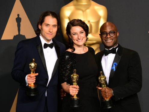 Jeremy Kleiner, Adele Romanski and Barry Jenkins with the award for Best Picture for Moonlight at the 89th Academy Awards (Ian West/PA)