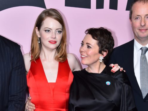 Emma Stone (left) and Olivia Colman star alongside Rachel Weisz in the black comedy about the court of Queen Anne (Matt Crossick/PA)