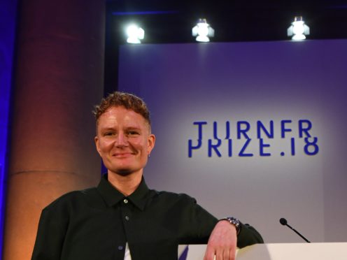 2018 Turner Prize winner Charlotte Prodger accepts the award during a ceremony at Tate Britain in London. (Victoria Jones/PA)