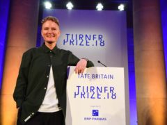 2018 Turner Prize winner Charlotte Prodger accepts the award during a ceremony at Tate Britain in London. (Victoria Jones/PA)