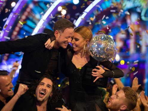 Kevin Clifton and Stacey Dooley celebrate with the glitterball trophy (Guy Levy/PA)